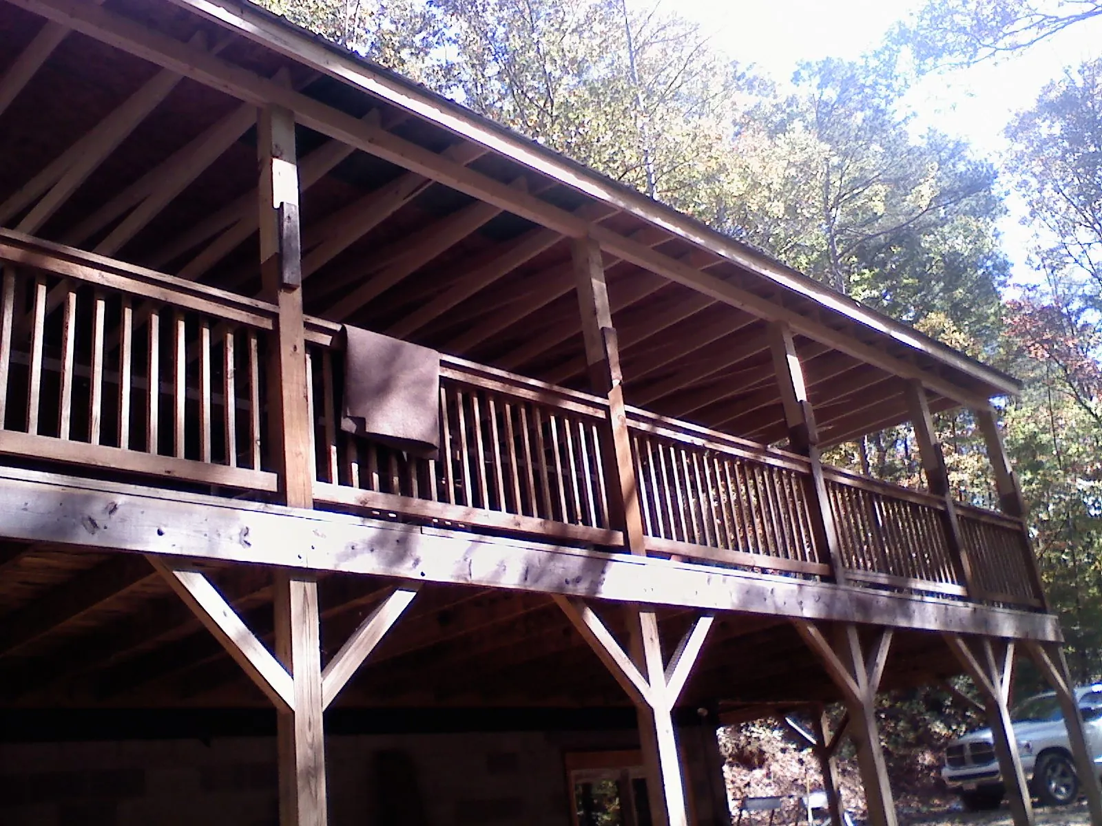 Timber framing under a new elevated porch and deck — Roof Leak Repair in Forsyth by Roofing Brothers